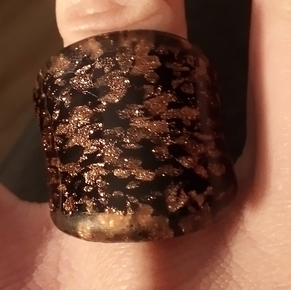 Women's size six plastic glitter ring